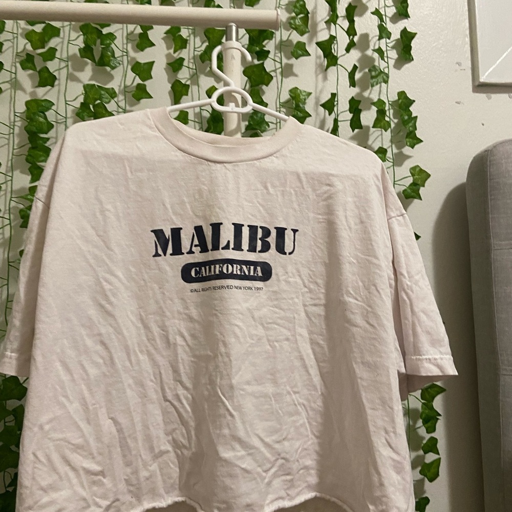 J. Galt, 100% cotton, one size I’m 4,11 and it’s a little big so fits S,M and L